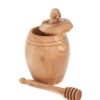 Olive wood honey pot with lid and wooden dipper, close-up