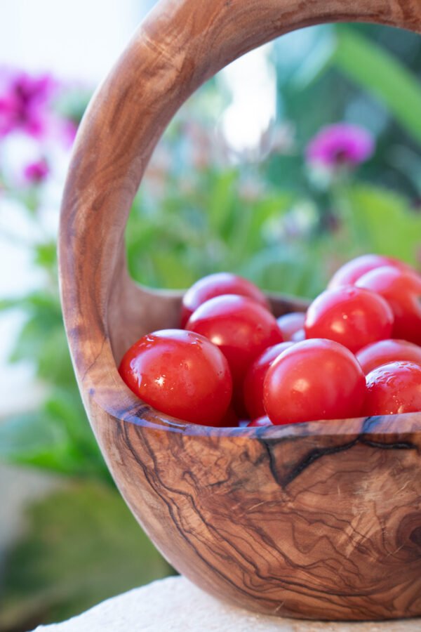 Olive Wood Fruit Basket - Side View Olive wood fruit basket with handle, side view