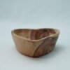 Olive wood heart-shaped bowl, close-up of grain