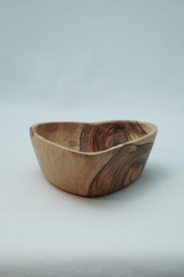 Olive wood heart-shaped bowl, close-up of grain