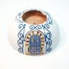 Round Painted Olive Wood Candle Holder 1 Olive wood candle holder, close-up of painted detail