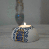 Round Painted Olive Wood Candle Holder 5 Hand-painted olive wood candle holder, angled view