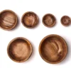 Olive wood bowls set, filled with food