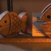 22 Olive wood fish sculpture, close-up of grain