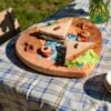 Olive wood heart-shaped board, close-up of ceramic tile