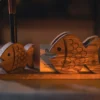 DSC08457 Olive wood fish duo desk stand, on shelf
