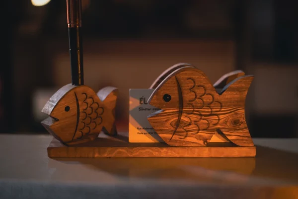 DSC08457 Olive wood fish duo desk stand, on shelf