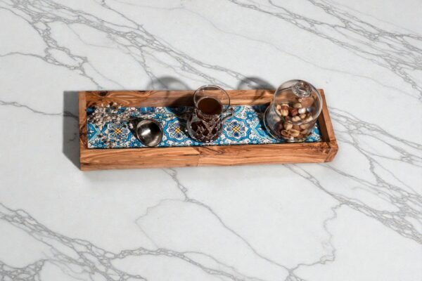 Tray with ceramic Olive wood ceramic serving tray, close-up of blue tiles