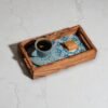 Ceramic Tray (2) Olive wood ceramic serving tray, close-up of tile