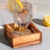 Olive wood ceramic coaster with handle, close-up