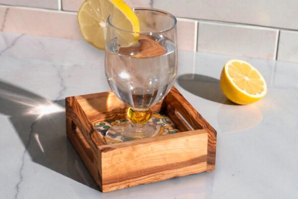 Olive wood ceramic coaster with handle, close-up