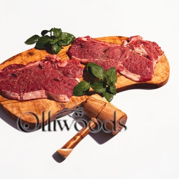 cuting board Olive wood cutting board, styled with bread and cheese